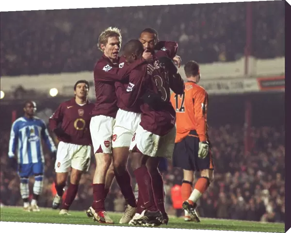 Theirry Henry celebrates scoring Arsenals 1st goal with Kerrea Gilbert and Alex Hleb