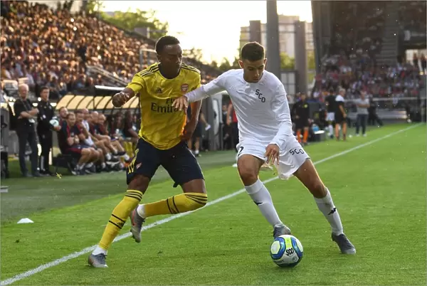 Arsenal's Joe Willock Faces Off Against Angers Rachid Alioui in 2019 Pre-Season Friendly