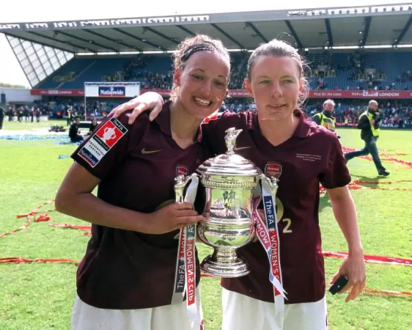Lianne Sanderson and Kirsty Pealling (Arsenal) with the FA Cup Trophy
