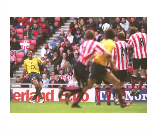 Theirry Henry shoots past Sunderland goalkeeper Kelvin Davis to score the 3rd Arsenal goal from a fr