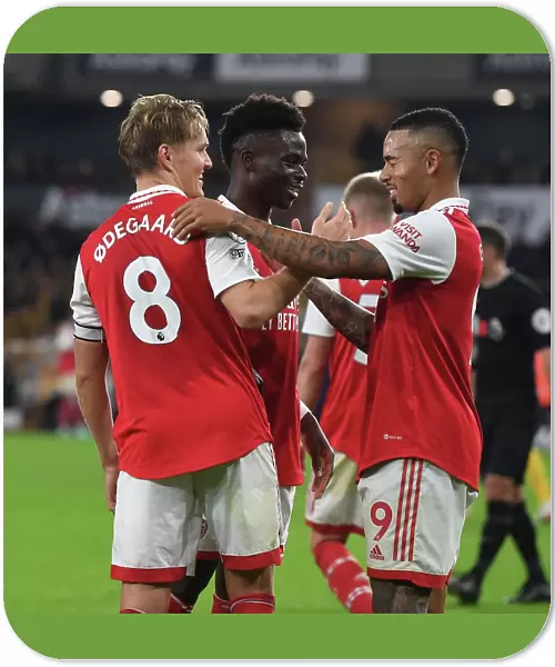 Arsenal's Odegaard and Saka: Celebrating Goals in Style against Wolverhampton Wanderers (2022-23)