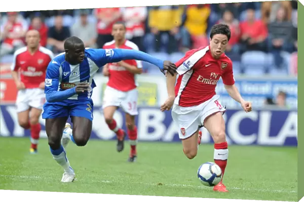 Samir Nasri (Arsenal) Mohamed Diame (Wigan). Wigan Athletic 3: 2 Arsenal