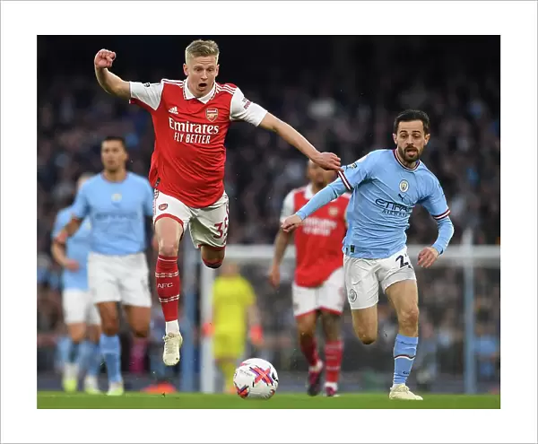 MANCHESTER, ENGLAND - APRIL 26: Oleksandr Zinchenko of Arsenal is challenged by Bernardo Silva of Manchester City during the Premier League match between Manchester City and Arsenal FC at Etihad Stadium on April 26, 2023 in Manchester, England