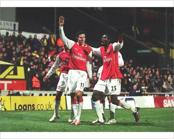 Robin van Persie celebrates scoring the 2nd Arsenal goal with Emmanuel Adebayor