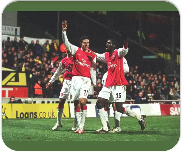 Robin van Persie celebrates scoring the 2nd Arsenal goal with Emmanuel Adebayor