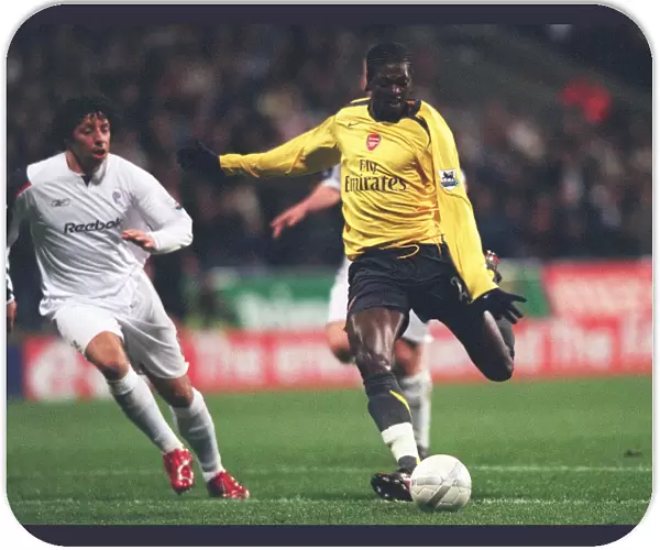 Emmanuel Adebayor breaks past Bolton defender Ivan Campo to score the 1st Arsenal goal