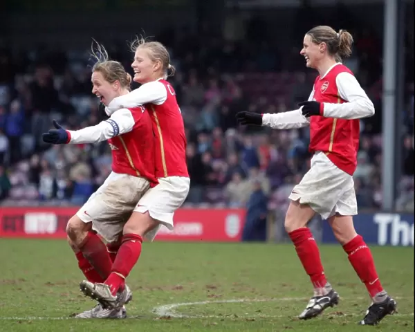 Arsenal Ladies Triumph: Jayne Ludlow, Katie Chapman, and Kelly Smith Celebrate League Cup Final Goal