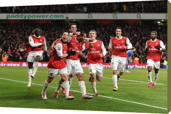 Theo Walcott celebrates scoring Arsenals 3rd goal with his team mates