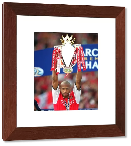 Thierry Henry with the F. A. Barclaycard Premiership Trophy