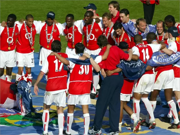 The Arsenal players celebrate at the end of the match