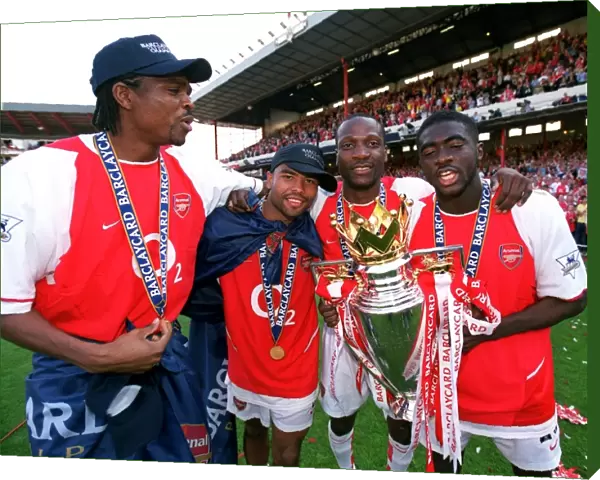 Kanu, Ashley Cole, Lauren and Kolo Toure (Arsenal) with the Premiership Trophy