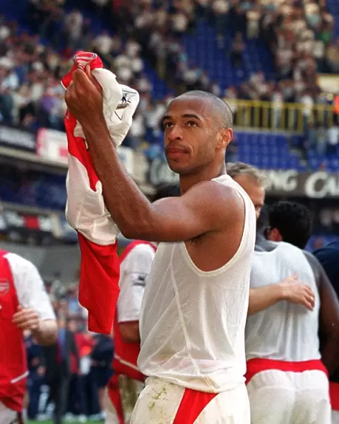 Thierry Henry celebrates pointing to his Badge. Tottenham Hotspur v Arsenal
