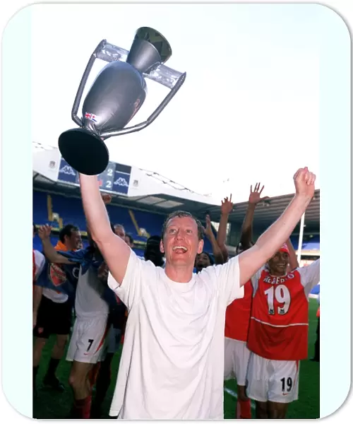 Ray Parlour's Triumph: Arsenal's League Victory Celebration at White Hart Lane, 2004