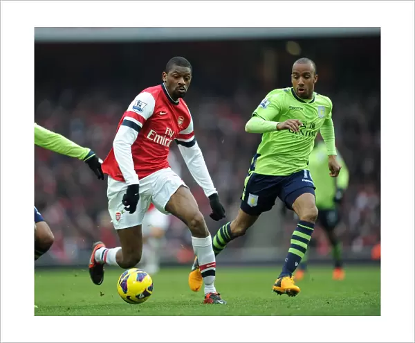 Arsenal's Abou Diaby Clashes with Aston Villa's Fabian Delph in Premier League Showdown