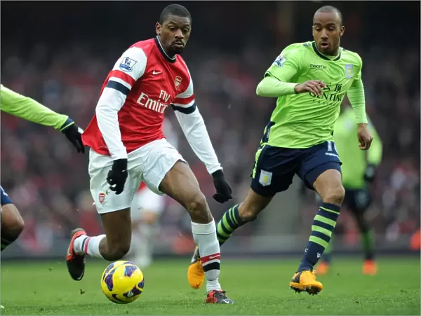 Arsenal's Abou Diaby Clashes with Aston Villa's Fabian Delph in Premier League Showdown