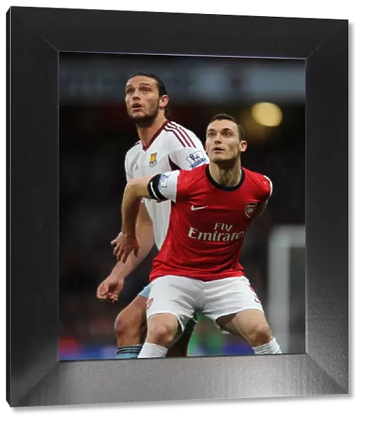 Arsenal's Thomas Vermaelen Holds Off Andy Carroll in Intense Arsenal v West Ham United Clash
