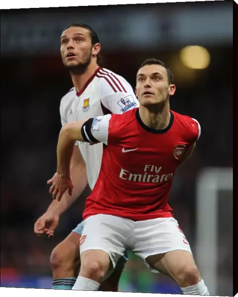 Arsenal's Thomas Vermaelen Holds Off Andy Carroll in Intense Arsenal v West Ham United Clash