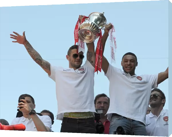 Arsenal Champions: Jack Wilshere and Alex Oxlade-Chamberlain Celebrate Victory on the Trophy Parade, Islington (May 18, 2014)