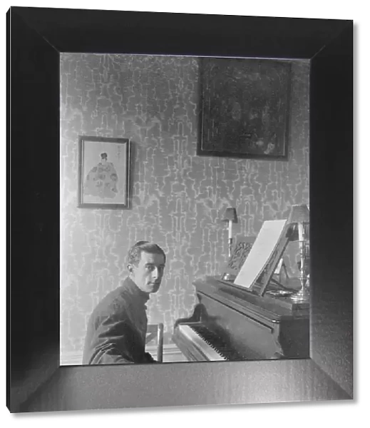 Joseph-Maurice Ravel (Ciboure or Ziburu, 1875 - Paris, 1937), French composer and pianist, in his flat on Carnot avenue, Paris, March 1912