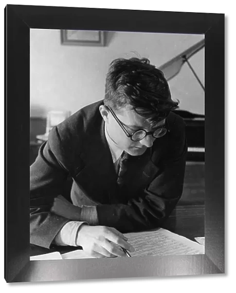Soviet composer, dmitri shostakovich, working in his study, 1938