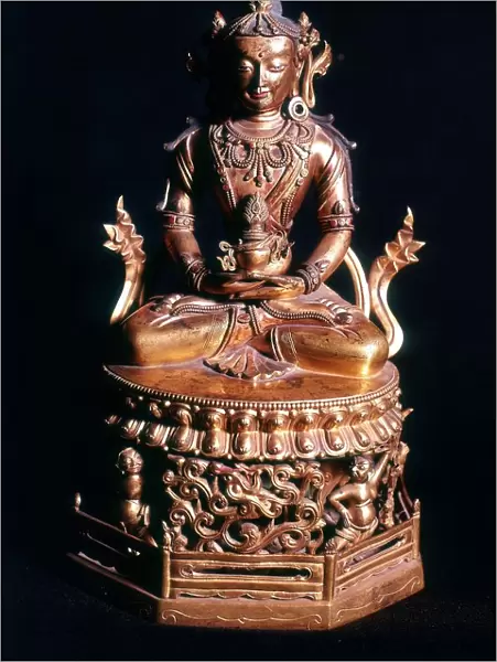 Amitaba Buddha in his manifestation of Boundless Life sitting holding a vessel containing