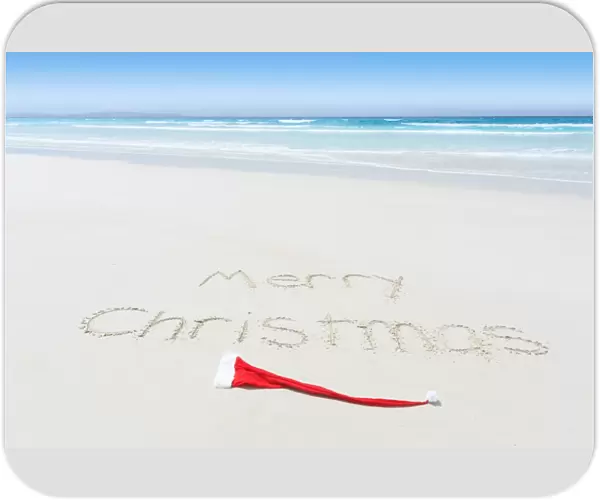 Merry Christmas written on a beach