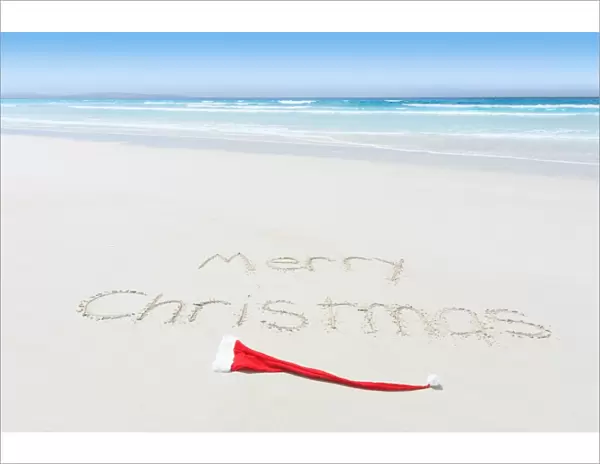 Merry Christmas written on a beach