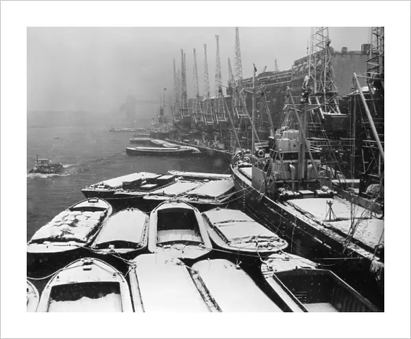 In Berth; Dutch ship Lingestroom covered in snow at Hays Wharf in the Pool of London