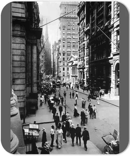 circa 1910: Wall Street facing south towards Trinity Church