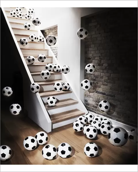 Footballs falling down from staircase