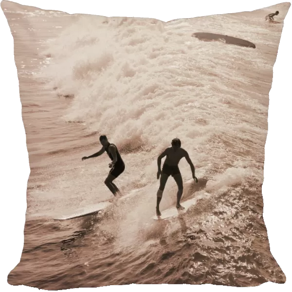 Men surfing waves