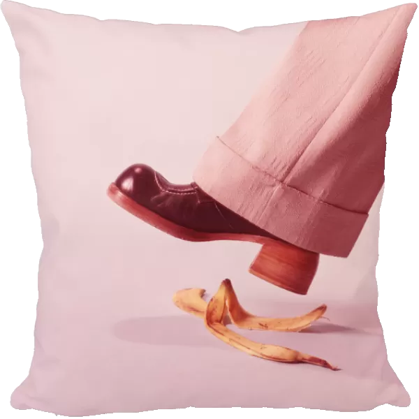 Person about to step on banana skin