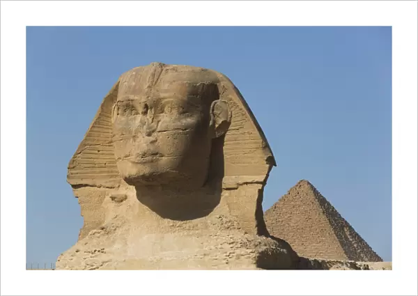 Sphinx (foreground), Pyramid of Mycerinus (background), The Giza Pyramids