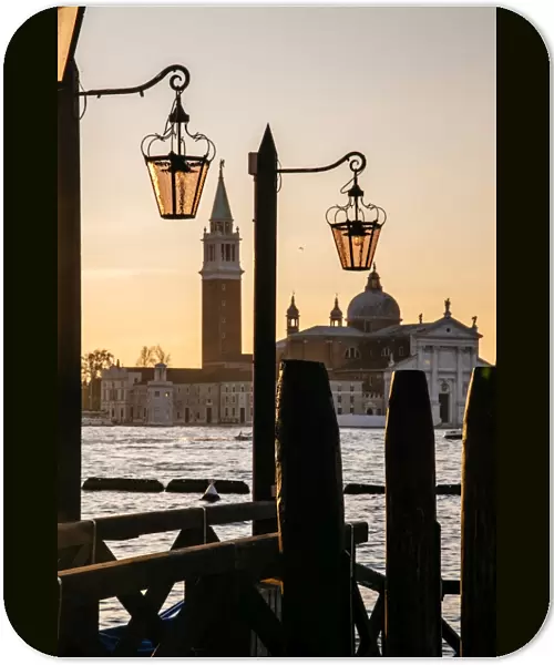 Venetian street lanterns with Church of San Giorgio Maggiore on the backround at sunrise