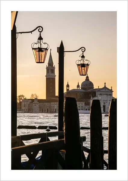 Venetian street lanterns with Church of San Giorgio Maggiore on the backround at sunrise