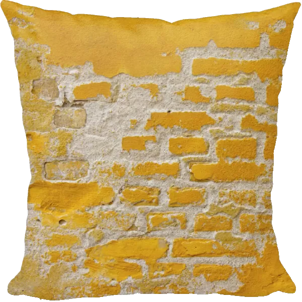 Ochre yellow brick wall