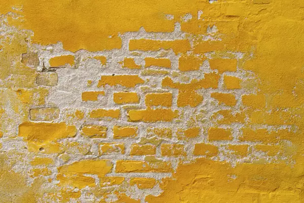 Ochre yellow brick wall
