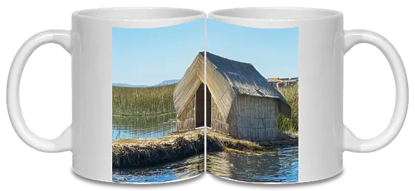Reed hut, floating islands of the Uros on Lake Titicaca, Puno, Peru