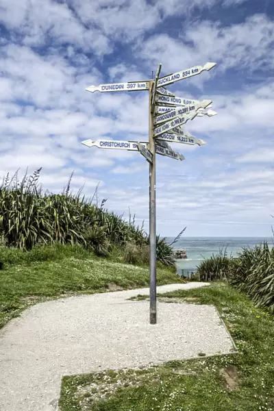Signpost at Far-Away-Point, Tauranga Bay, Cape Foulwind, South Island, New Zealand, Oceania