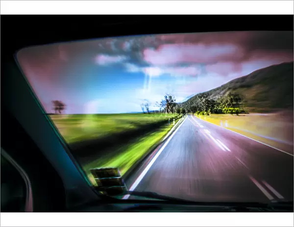Driving under the influence of drugs, danger to road traffic, driving on the left, view from inside a car on the road, driving fast, West Coast, New Zealand, Oceania