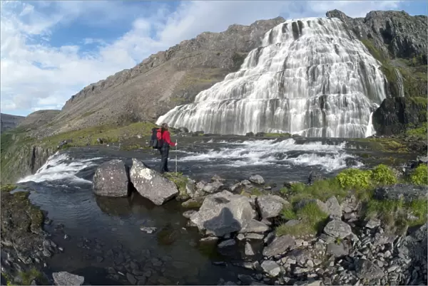 Hiker at Dynjandifoss or Fjallfoss Waterfall, Westfjords, Iceland, Europe