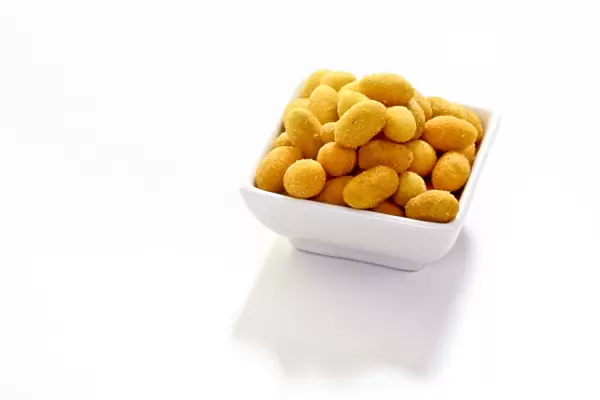 Peanuts in a paprika flavoured coating, in a bowl