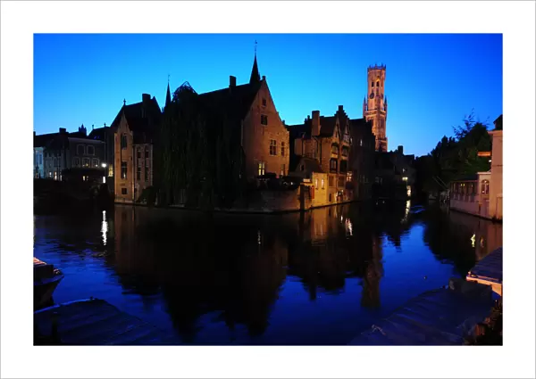 A view of Bruges old city and its canals at dusk