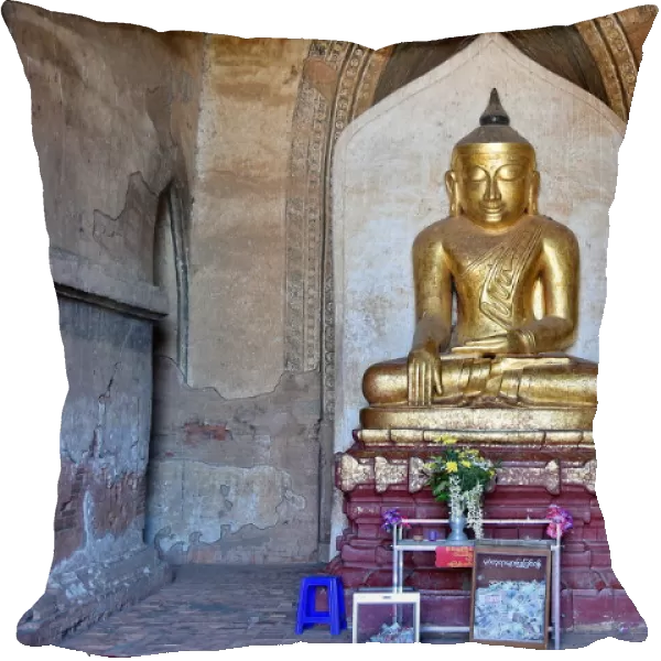 Gold buddha inside Dhamma Yan Gyi entrance Temple, Bagan, unesco ruins Myanmar. Asia