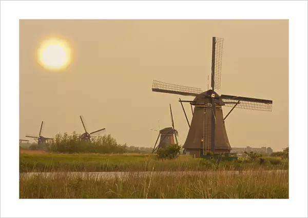 Windmills at sunset in Kinderdijk, Netherlands