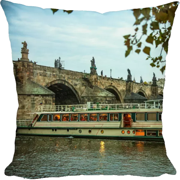 Charles bridge in Prague and a tourist boat