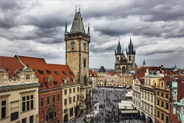 High angle view of Clock Tower, Old Town Square and Tyn Church on a clody gloomy day, Prague, Czech Republic