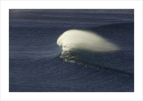 Single wave rushing toward beach, Australia