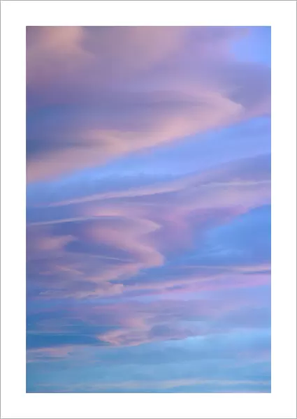 Sunset lenticular and cumulus clouds, Patagonia, AR