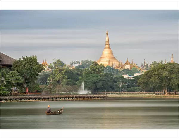 Shwedagon Pagoda in the morning view at wooden boardwalk at the Kandawgyi Lake in Yangon, Myanmar